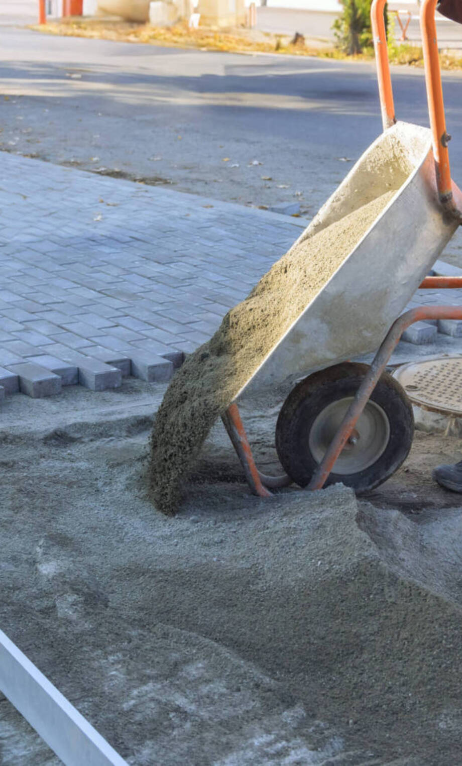 worker-pushes-wheelbarrow-pouring-gravel-for-new-p-2026-03-25-00-25-32-utc